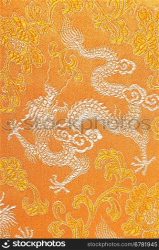 Textile in yellow with dragon on it