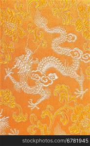 Textile in yellow with dragon on it