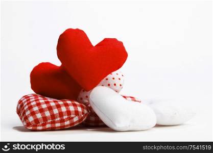Textile red hearts isolated on white background. Textile hearts on white