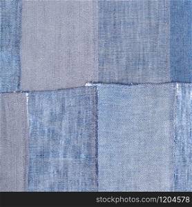 textile square background - patchwork from old denim flaps. patchwork from old denim flaps