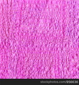 textile square background - wrinkled surface of scarf stitched from crushed pink cotton fabric