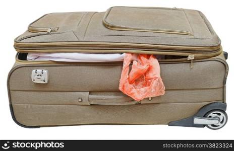 textile suitcase with fell out female pink panties isolated on white background