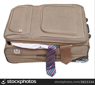 textile suitcase with two fell out ties isolated on white background