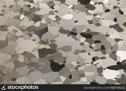 texture and background concept - khaki grey stylized camouflage wallpaper. close up of motley background