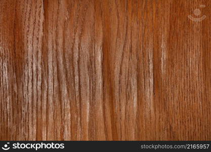 Texture and background of brown oak wood veneer with bumps and cracks. Close-up.. Texture of wood veneer with bulges and cracks.