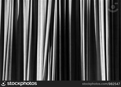 Texture background black and white curtain and shadow of light.