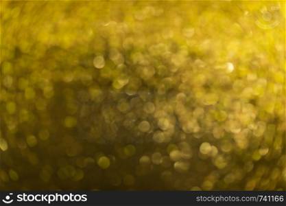 Texture background of blurred gold color