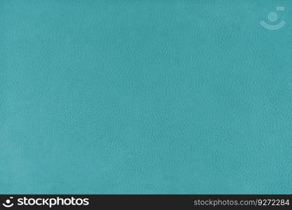 Texture background of turquoise velours fabric textured like leather surface. Fabric texture close up of upholstery furniture textile material, design interior, wall decor, backdrop, wallpaper.