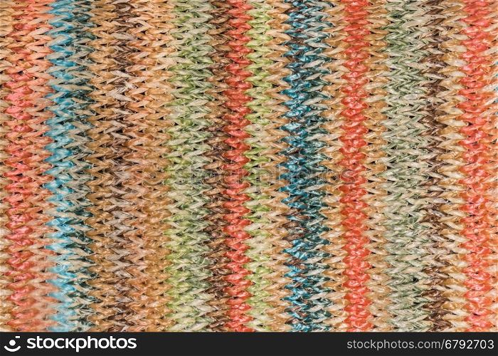 Texture background of woven straw with colorful pinstripe