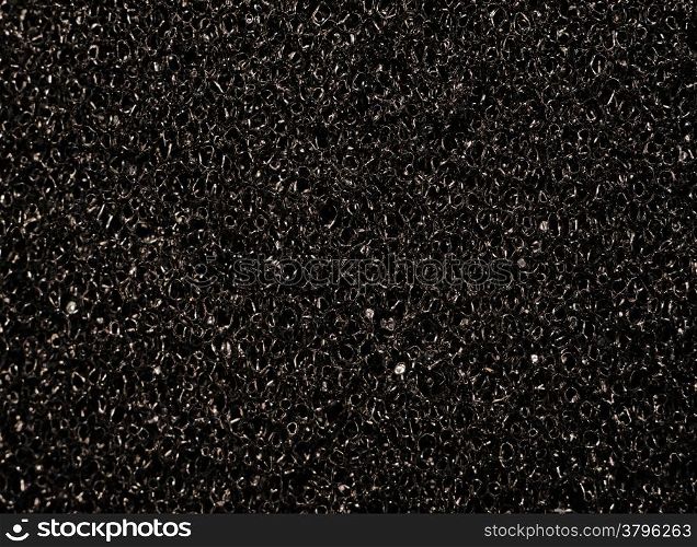 Texture black synthetic porous sponges as background