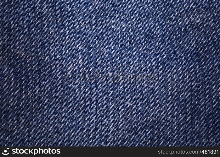 Texture denim. Cloth rough, worn, with small defects, slight darkening at the corners. Realistic fabric pattern for all purposes