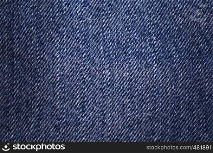 Texture denim. Cloth rough, worn, with small defects, slight darkening at the corners. Realistic fabric pattern for all purposes