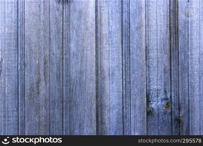 Texture from wooden vertical boards like fence. Background from boards of wooden fence. Wooden pattern of old boards. Texture from wooden vertical boards like fence