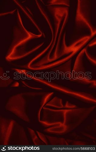 texture of a black silkcloth red satin silk close up