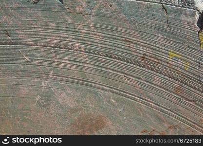 texture of a cut natural stone with traces of tools