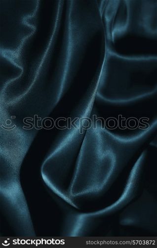 texture of a dark blue silk close up