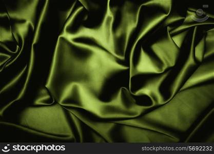 texture of a dark green silk