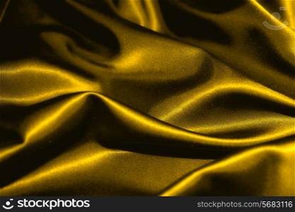 texture of a gold satin extreme close up