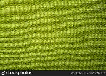 texture of a green knitted fabric close up
