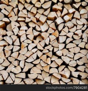 Texture of a stack of chopped firewood