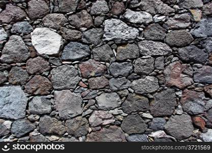 Texture of a wall made from volcanic stone