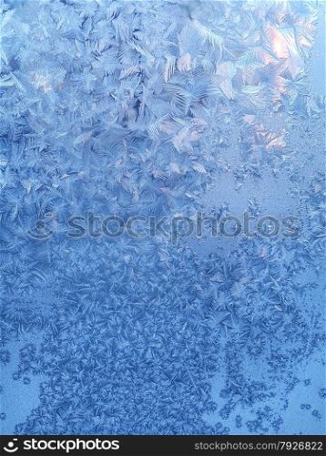 Texture of beautiful ice pattern on winter glass