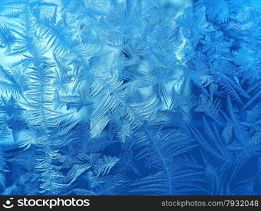 Texture of beautiful ice pattern on winter glass