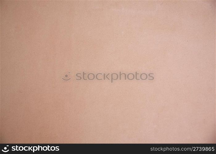 Texture of beige leather background closeup