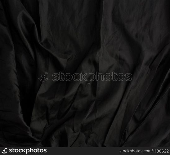 texture of black cotton fabric with waves, full frame, fabric for sewing clothes, shirts. Design Element