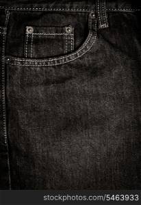 Texture of black jeans textile with sewing close up