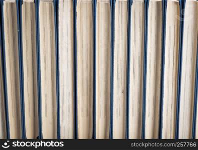 texture of books with blue cover and yellow pages, full frame