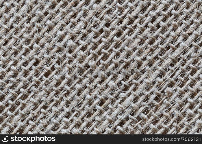 Texture of brown hemp sack for the design pattern background.