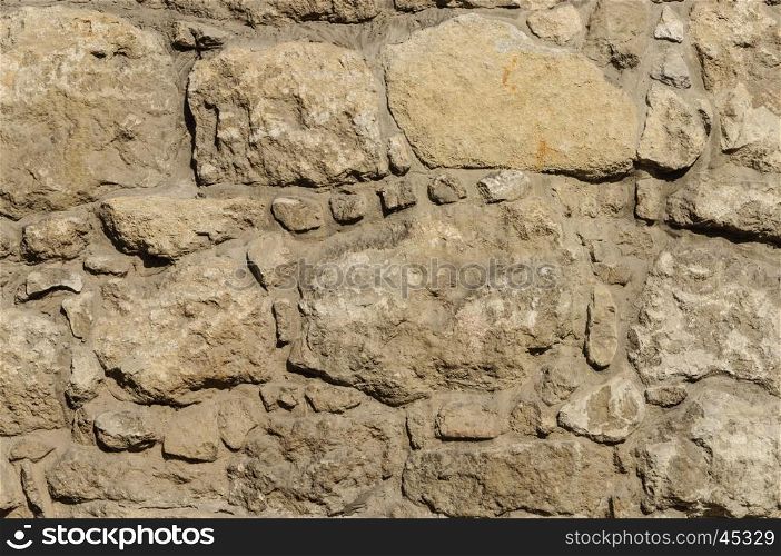 Texture of brown stone wall surface of ancient building