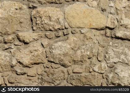 Texture of brown stone wall surface of ancient building