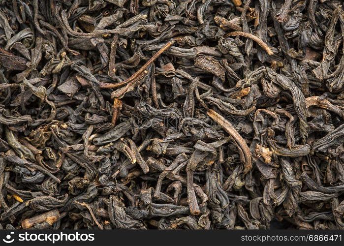 texture of Chinese souchong black tea, macro image of loose leaves