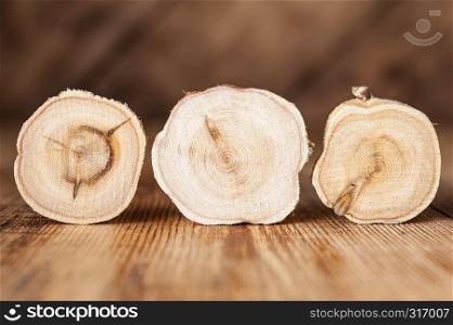 Texture of cross section wood logs. Pattern of juniper tree stump background. Circles juniper wood slice cross section with tree rings that show age organic history.. Texture of cross section juniper wood. Pattern of tree stump background. Circles slice of juniper.