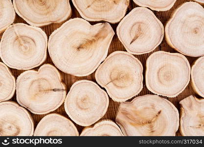 Texture of cross section wood logs. Pattern of juniper tree stump background. Circles juniper wood slice cross section with tree rings that show age organic history.. Texture of cross section juniper wood. Pattern of tree stump background. Circles slice of juniper.