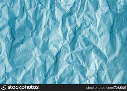 texture of crumpled rough blue wrapping paper, background