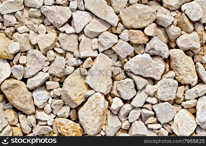 Texture of crushed sandstone on the road