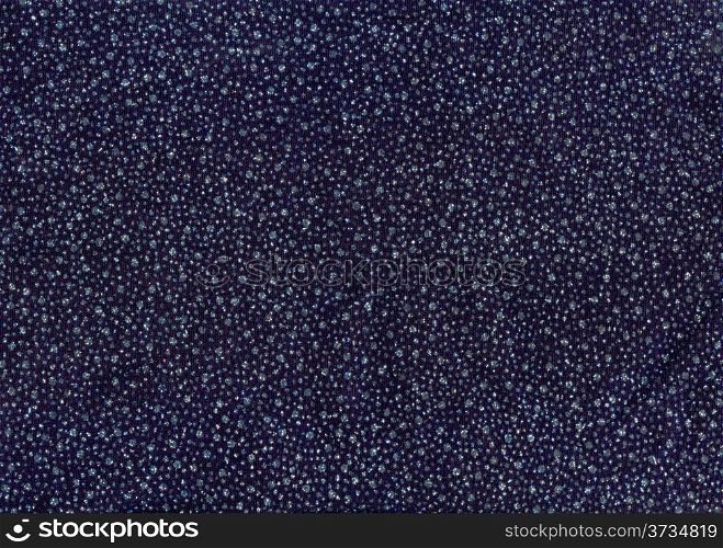 Texture of dark blue cloth with silver and blue sequins as background