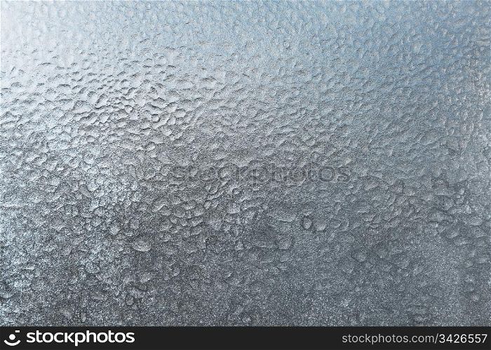texture of frozen water drops on glass
