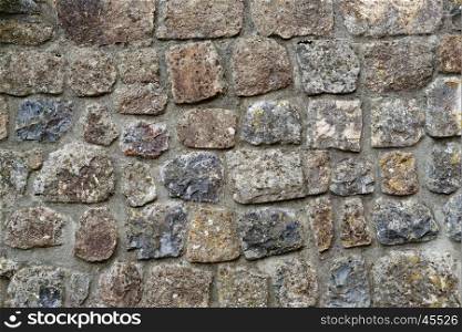 Texture of gray stone wall covered with lichen . Texture of gray stone wall covered with lichen