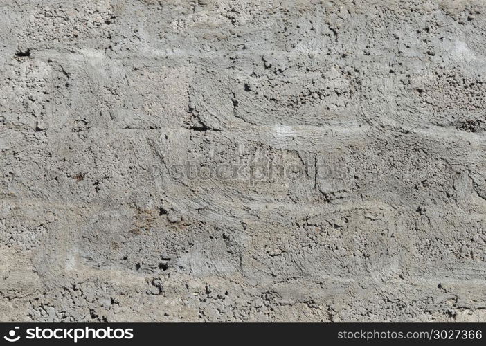 Texture of grey concrete block wall surface. Wall background of concrete blocks