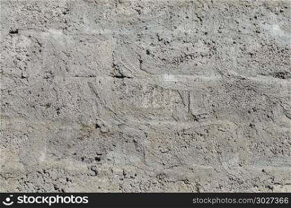 Texture of grey concrete block wall surface. Wall background of concrete blocks