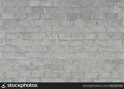 Texture of grey concrete blocks wall surface. Wall of concrete blocks