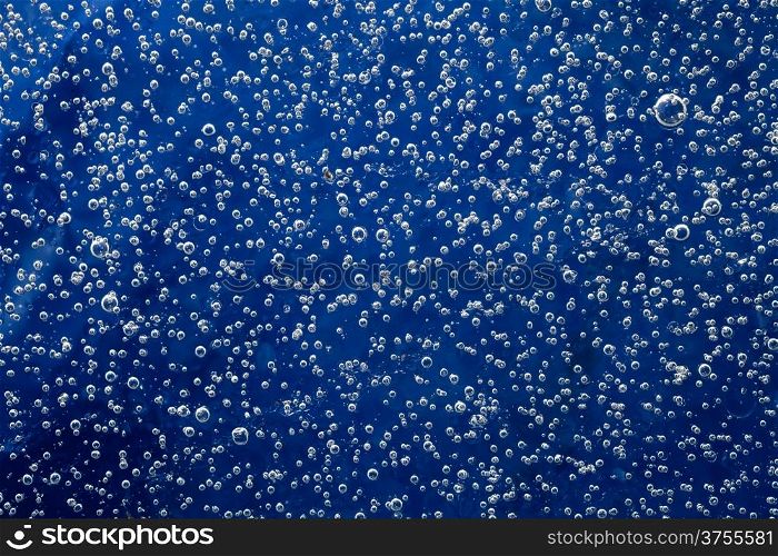 Texture of ice with bubbles for background. Natural blue ice pattern