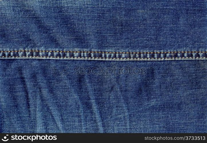 Texture of jeans cloth with a seam