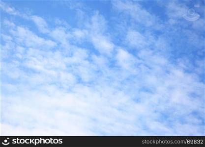 Texture of light clouds in the blue sky - cloudscape background