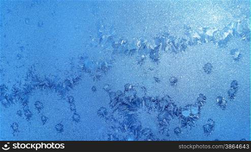 Texture of natural ice pattern on winter glass