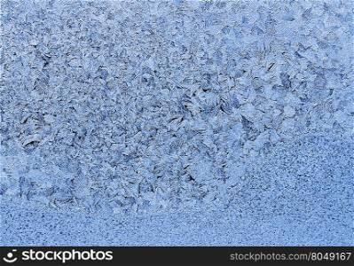 Texture of natural ice pattern on winter glass